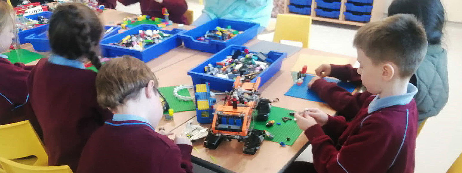 School children playing with logo as part of City Connects project.