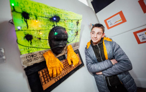 St. Canice's School student pictured with his artwork, which is part of the exhibition 'Identity' at Mary Immaculate College, Limerick.