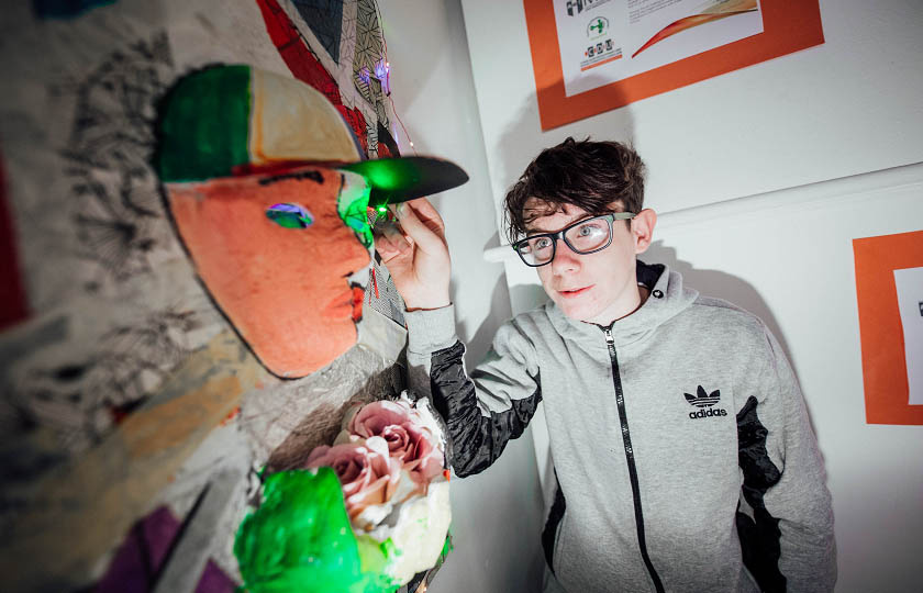 St. Canice's student pictured with his artwork, which is part of the exhibition 'Identity' at MIC, Limerick.