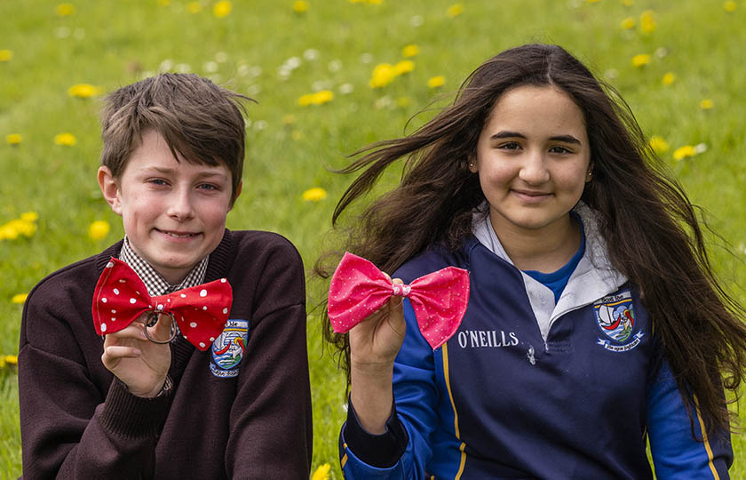 Two students displaying their bows made during the JEP programme.