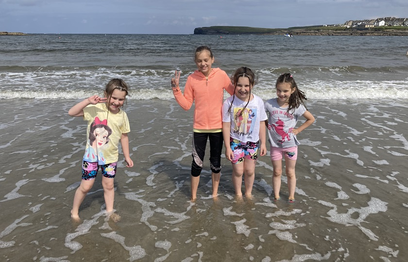 Four children at the beach as part of EDNIP